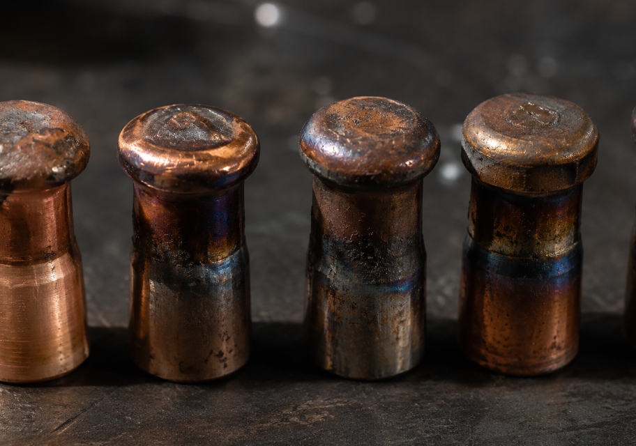 Worn spot welding electrode caps showing mushrooming and brass discoloration